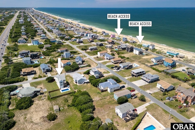 bird's eye view with a water view and a residential view