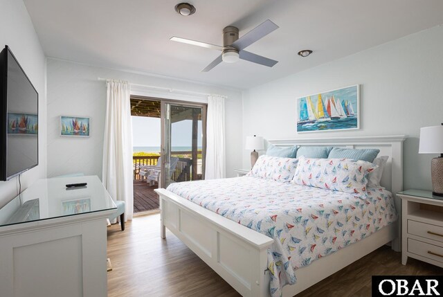 bedroom with a ceiling fan, access to outside, and dark wood-style flooring