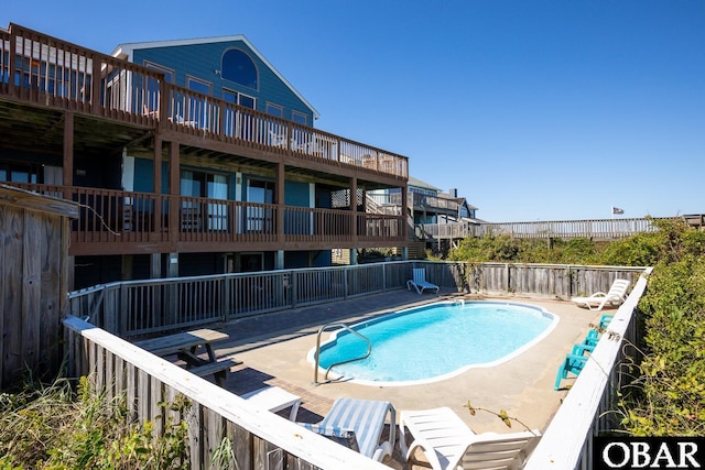 view of swimming pool with a fenced in pool, a patio area, and fence