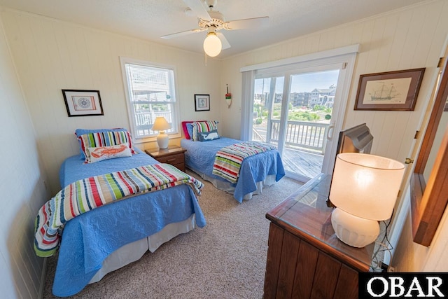 1518 N Virginia Dare Trl Lot # 11, Kill Devil Hills, NC 27948 - bedroom featuring carpet, access to outside, ceiling fan, ornamental molding, and wood walls