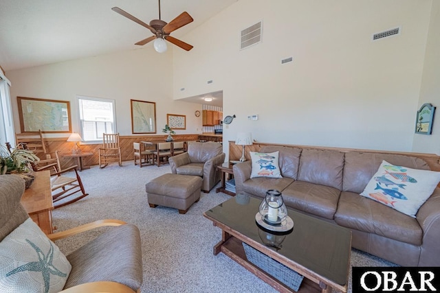 1518 N Virginia Dare Trl Lot # 11, Kill Devil Hills, NC 27948 - living area with ceiling fan, high vaulted ceiling, carpet flooring, a wainscoted wall, and wood walls