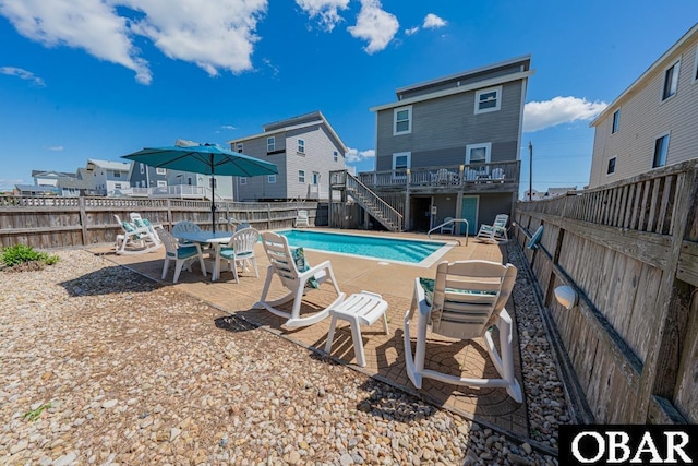 1518 N Virginia Dare Trl Lot # 11, Kill Devil Hills, NC 27948 - view of swimming pool featuring stairs, a fenced backyard, a patio, and a wooden deck