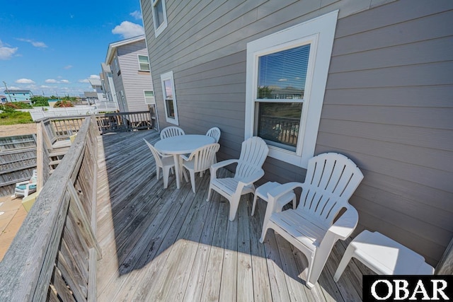 1518 N Virginia Dare Trl Lot # 11, Kill Devil Hills, NC 27948 - wooden deck featuring outdoor dining area