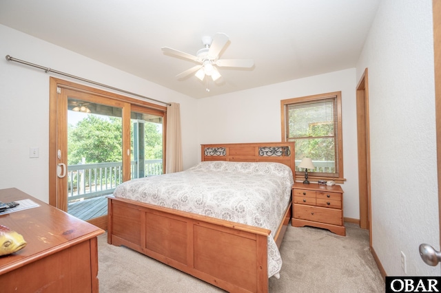 bedroom with ceiling fan, light colored carpet, and access to exterior