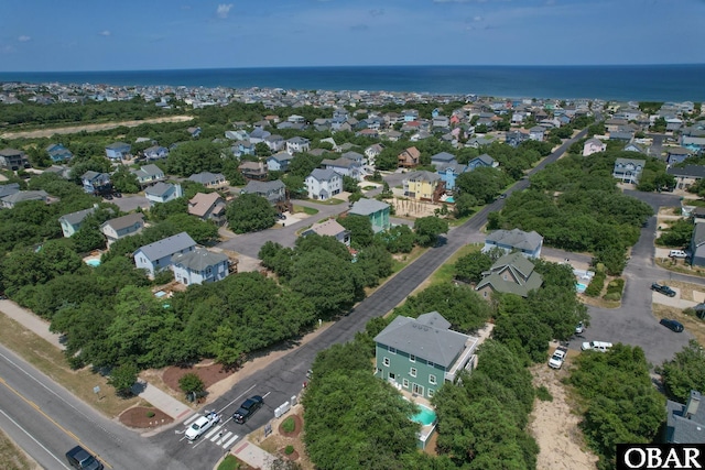 birds eye view of property featuring a water view and a residential view