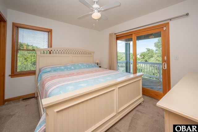 bedroom with baseboards, light carpet, ceiling fan, and access to exterior