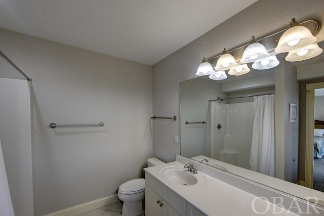 ensuite bathroom featuring baseboards, a shower with shower curtain, tile patterned floors, ensuite bathroom, and vanity