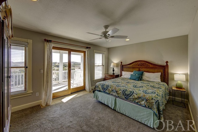 carpeted bedroom featuring a textured ceiling, access to outside, a ceiling fan, and baseboards