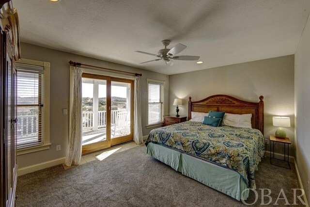carpeted bedroom featuring a textured ceiling, access to outside, a ceiling fan, and baseboards