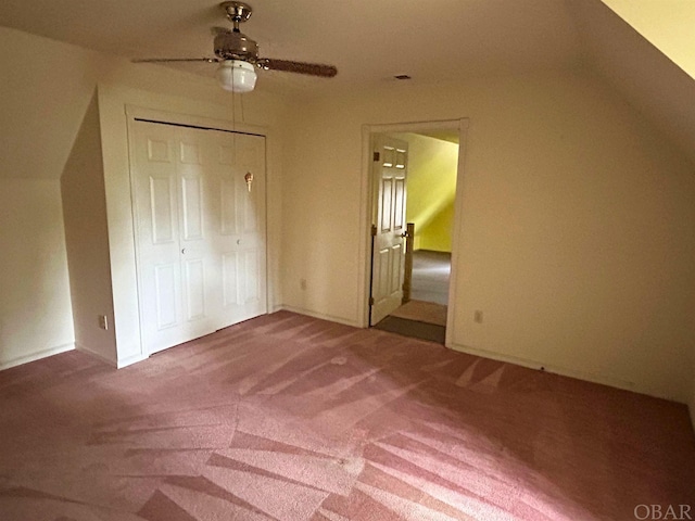 bonus room featuring a ceiling fan and carpet flooring