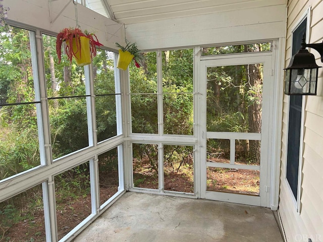 unfurnished sunroom with vaulted ceiling