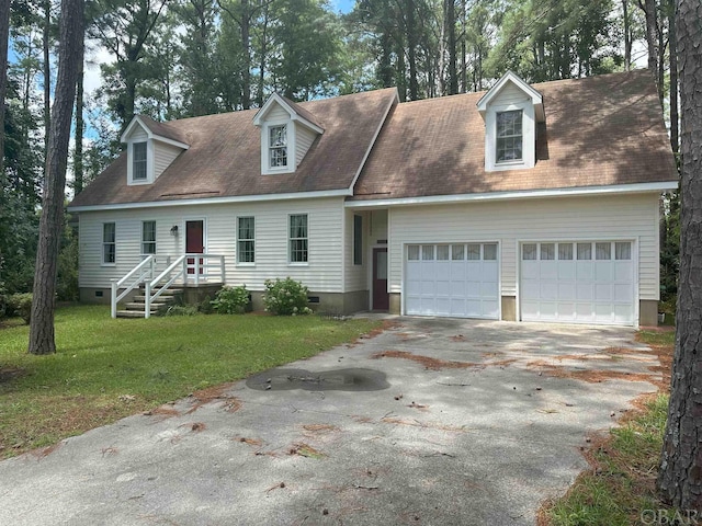 cape cod home with crawl space, driveway, a garage, and a front yard