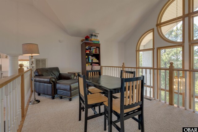1219 Bismark Dr Lot # 107, Corolla, NC 27927 - dining space with light colored carpet, healthy amount of natural light, and high vaulted ceiling