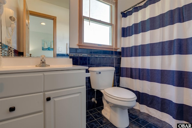 1219 Bismark Dr Lot # 107, Corolla, NC 27927 - bathroom featuring vanity, tile patterned floors, tile walls, and curtained shower