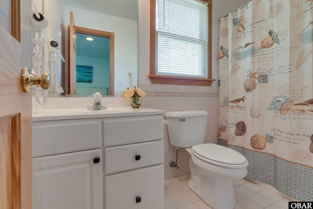 1219 Bismark Dr Lot # 107, Corolla, NC 27927 - bathroom with tile patterned floors, vanity, a shower with curtain, and tile walls