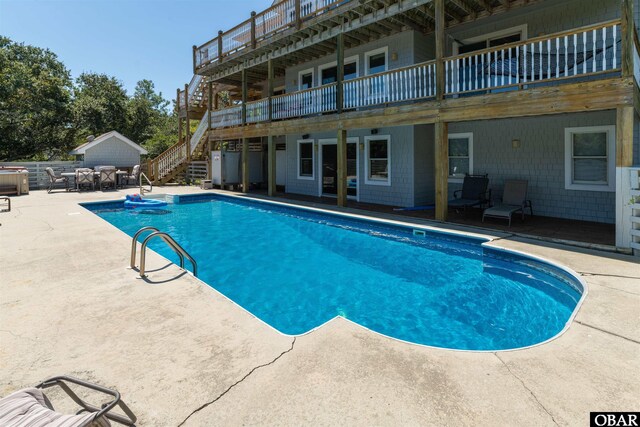 1219 Bismark Dr Lot # 107, Corolla, NC 27927 - swimming pool with stairway, a patio, and a wooden deck
