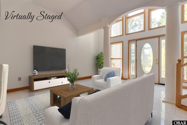 1219 Bismark Dr Lot # 107, Corolla, NC 27927 - living area featuring decorative columns, light tile patterned floors, healthy amount of natural light, and high vaulted ceiling