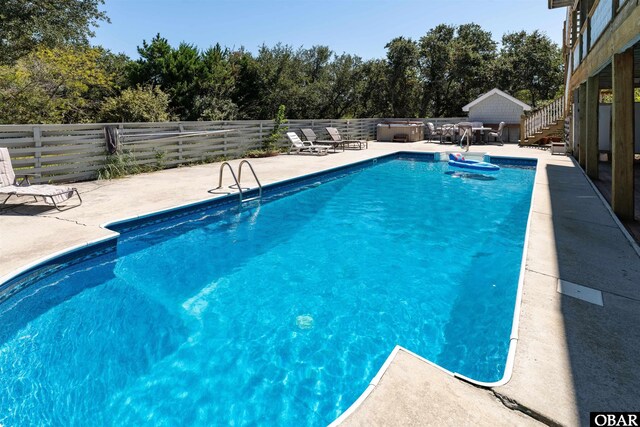 1219 Bismark Dr Lot # 107, Corolla, NC 27927 - view of swimming pool with a patio area, a fenced backyard, and stairway