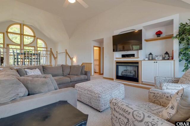 1219 Bismark Dr Lot # 107, Corolla, NC 27927 - living area featuring a ceiling fan, a fireplace, light colored carpet, and high vaulted ceiling