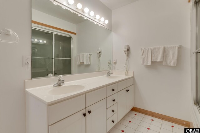 1219 Bismark Dr Lot # 107, Corolla, NC 27927 - full bathroom featuring double vanity, a shower with shower door, and tile patterned flooring