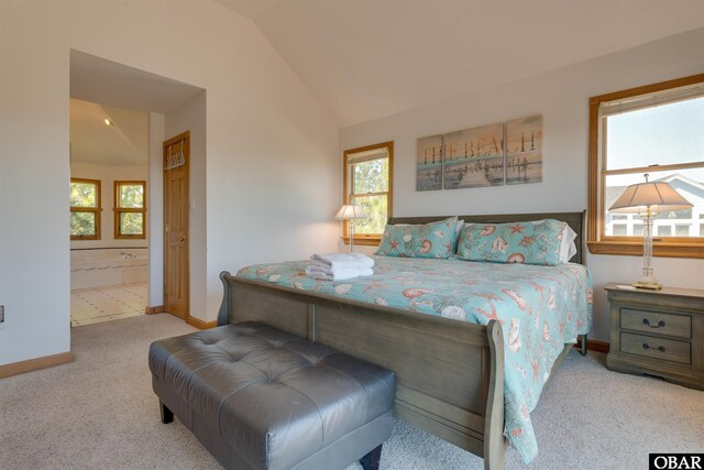 1219 Bismark Dr Lot # 107, Corolla, NC 27927 - bedroom with vaulted ceiling, carpet, and connected bathroom