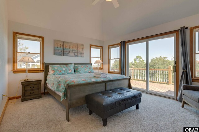 1219 Bismark Dr Lot # 107, Corolla, NC 27927 - carpeted bedroom with access to outside, multiple windows, ceiling fan, and vaulted ceiling