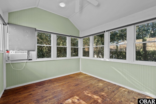 unfurnished sunroom with lofted ceiling, a healthy amount of sunlight, cooling unit, and ceiling fan