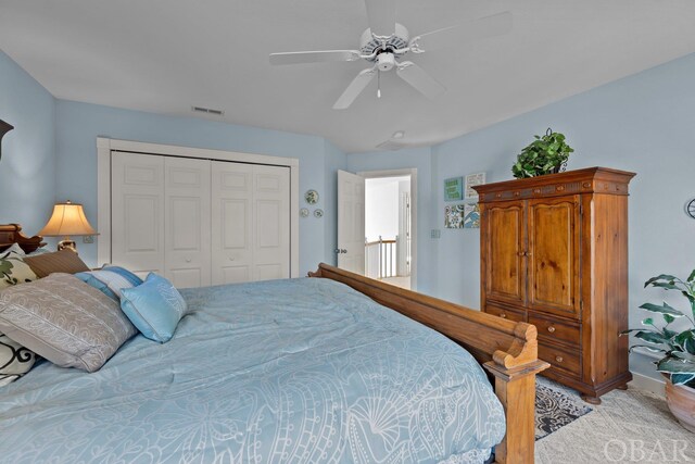 bedroom featuring a ceiling fan, a closet, and visible vents