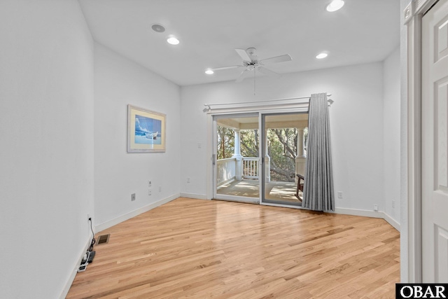 unfurnished room with light wood-type flooring, visible vents, baseboards, and recessed lighting