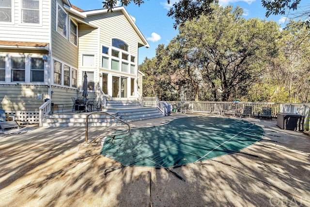 view of pool featuring a patio area and fence