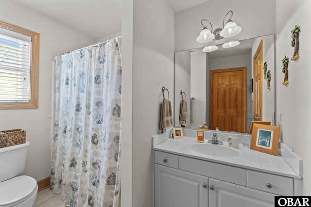 bathroom featuring a shower with curtain, toilet, tile patterned flooring, baseboards, and vanity