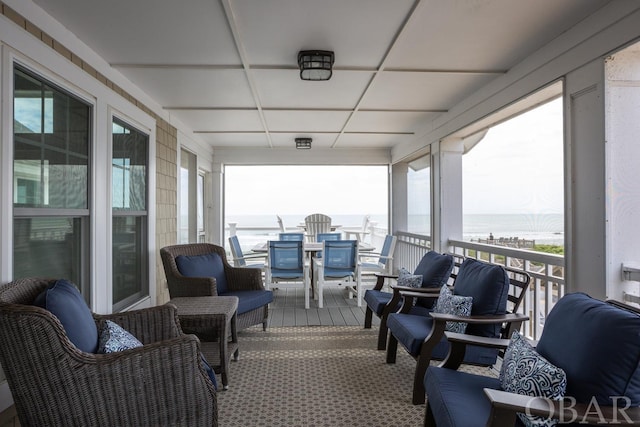 view of patio / terrace featuring outdoor dining space and a water view