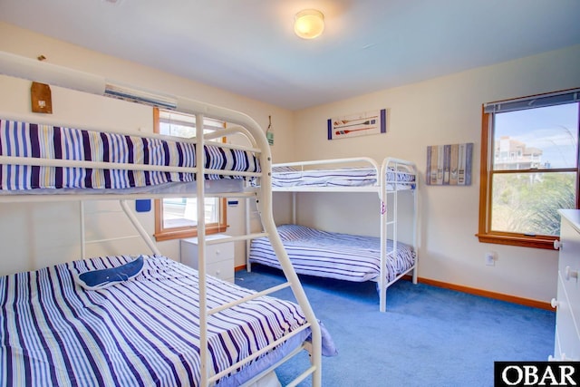 bedroom featuring carpet floors and baseboards