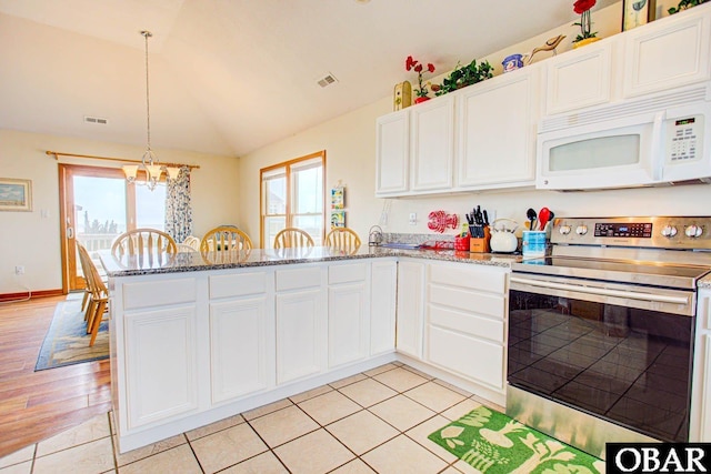 kitchen featuring stainless steel electric stove, white cabinetry, visible vents, and white microwave