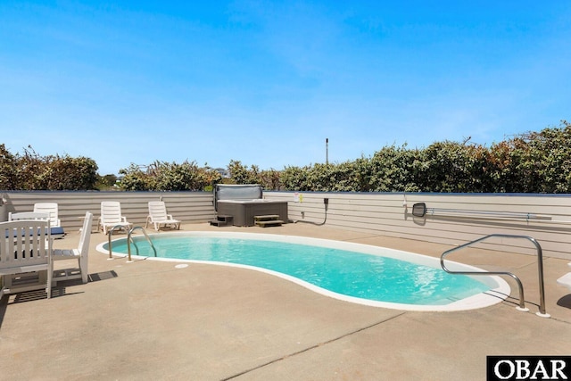 view of swimming pool featuring a patio area and a fenced in pool