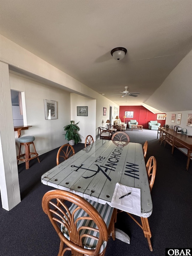 180 Irvin Garrish Hwy Unit 601, Ocracoke, NC 27960 - carpeted dining space featuring vaulted ceiling and ceiling fan