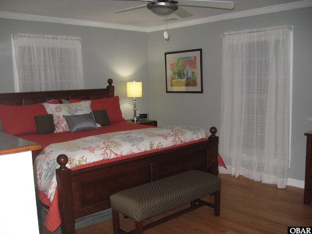 bedroom featuring ornamental molding, ceiling fan, and wood finished floors