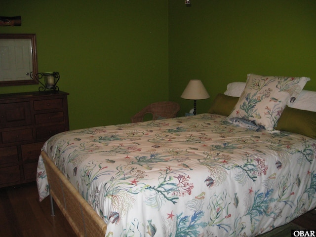 bedroom with wood finished floors