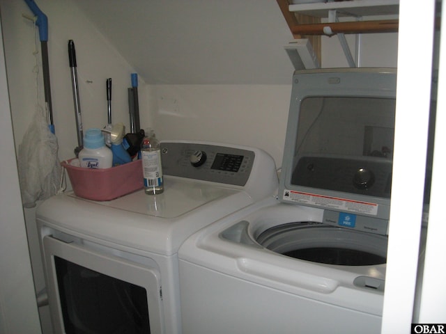 clothes washing area featuring laundry area and separate washer and dryer