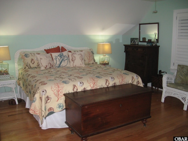 bedroom with wood finished floors