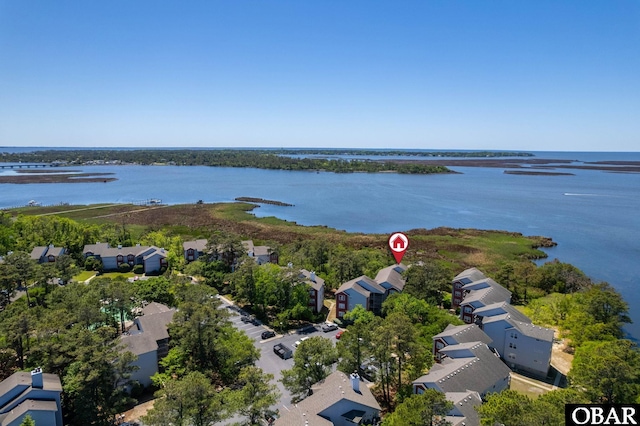 drone / aerial view featuring a water view and a residential view