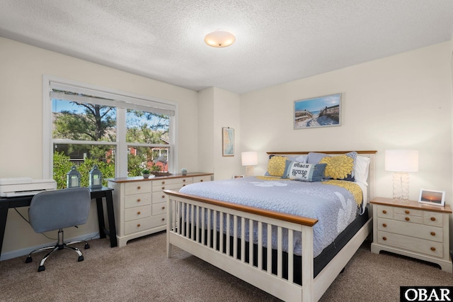 carpeted bedroom with a textured ceiling
