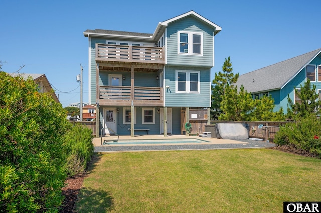 5009 Lindbergh Ave Lot 28, Kitty Hawk, NC 27949 - back of property with a balcony and a fenced backyard