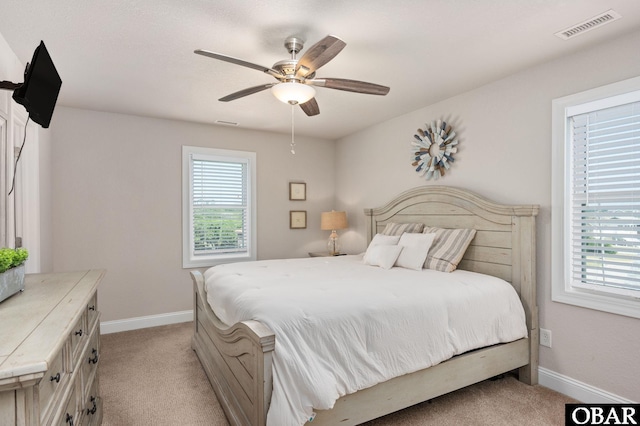 5009 Lindbergh Ave Lot 28, Kitty Hawk, NC 27949 - bedroom with light colored carpet, multiple windows, and a ceiling fan