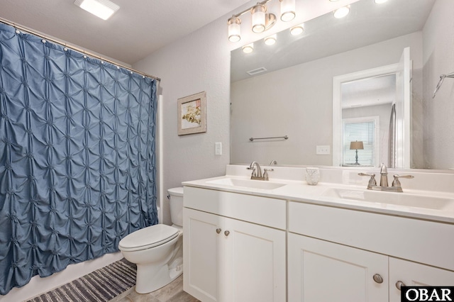 5009 Lindbergh Ave Lot 28, Kitty Hawk, NC 27949 - bathroom featuring double vanity and shower / bath combination with curtain