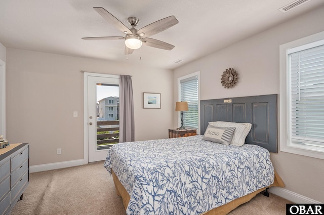 5009 Lindbergh Ave Lot 28, Kitty Hawk, NC 27949 - bedroom featuring light carpet, access to exterior, and a ceiling fan