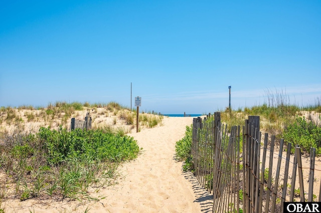 5009 Lindbergh Ave Lot 28, Kitty Hawk, NC 27949 - view of road with view of water and beach and a gated entry