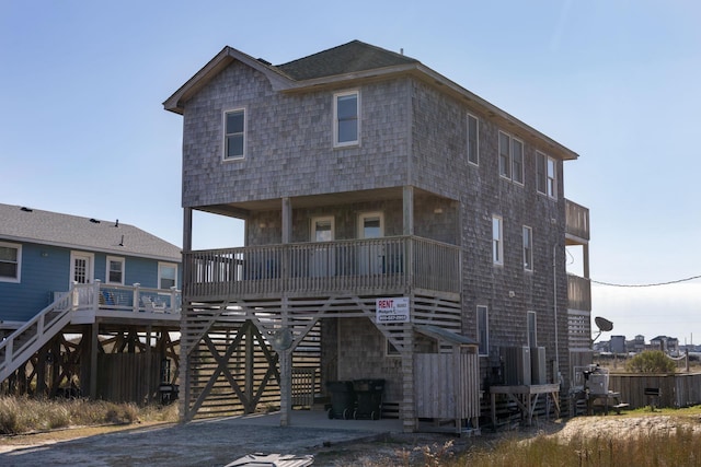 beach home featuring stairs