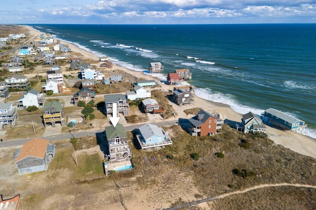 aerial view featuring a residential view, a water view, and a beach view