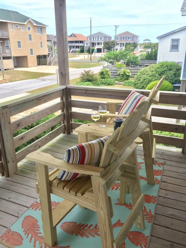 wooden deck featuring a residential view